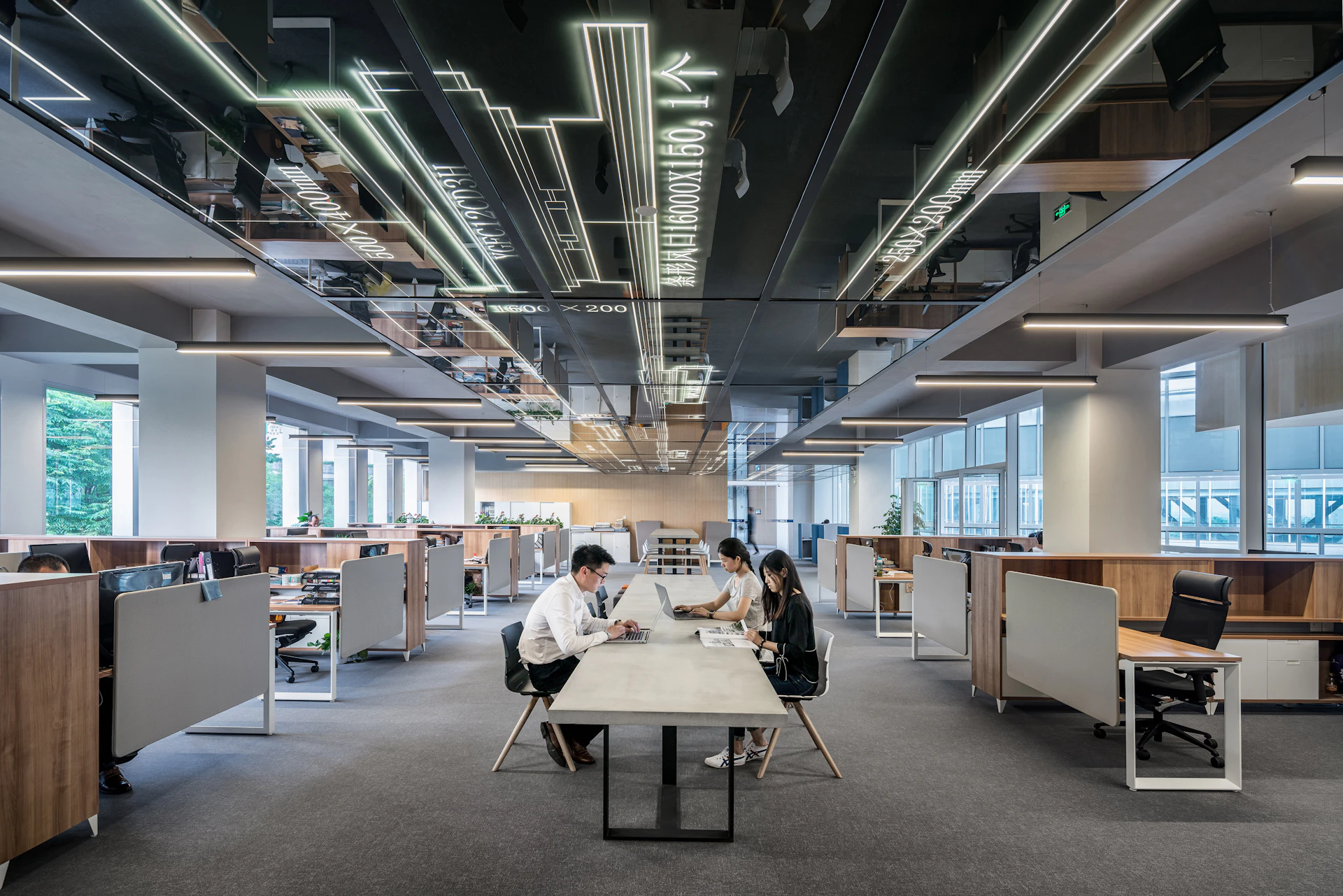 Shared worktable in the light-filled Shanghai Baoye Center by LYCS Architecture — reference photograph